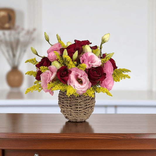 Close-up of Rosy Romance flower arrangement featuring red roses and pink eustoma in a small basket, ideal as a romantic flower gift.