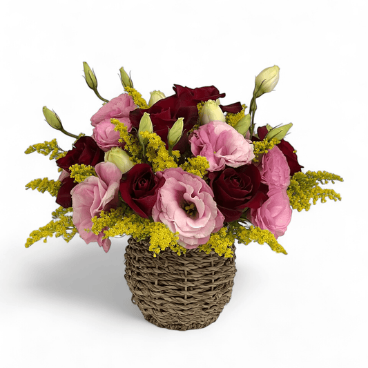 Close-up of Rosy Romance flower arrangement featuring red roses and pink eustoma in a small basket, ideal as a romantic flower gift.